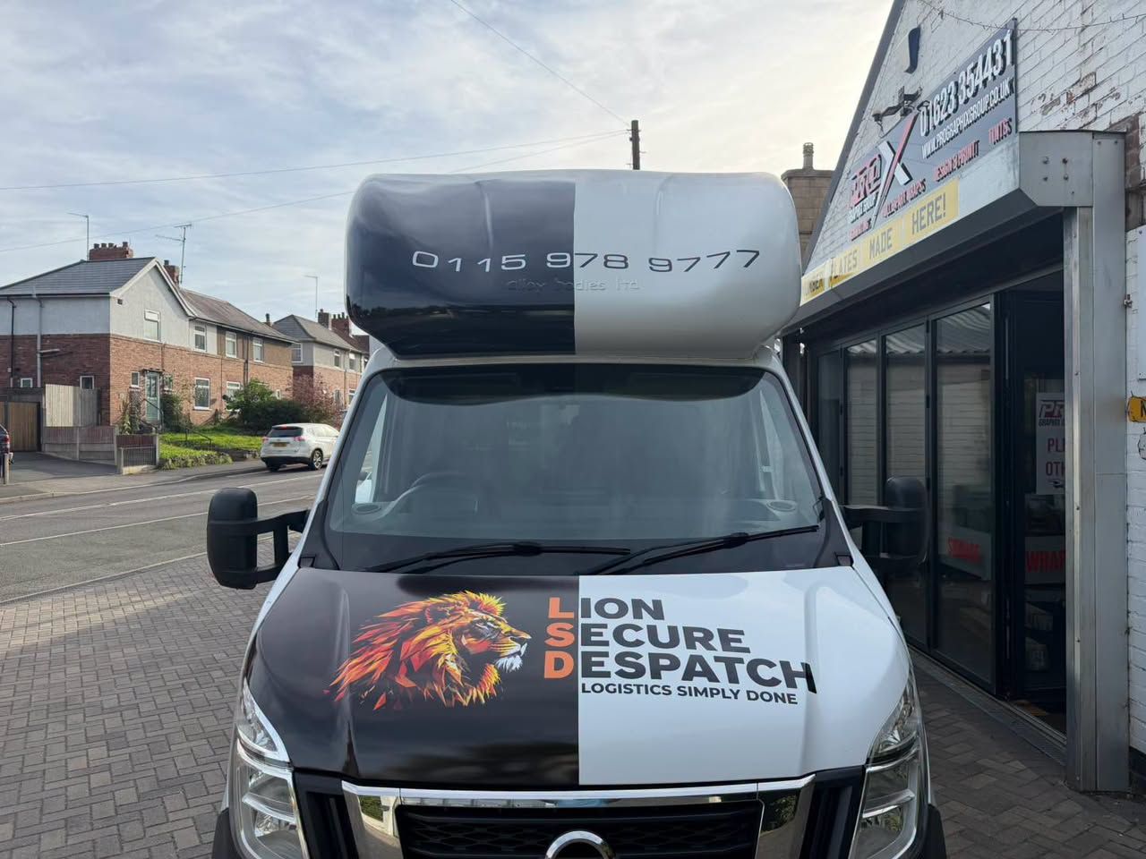 Front of the Lion Secure Despatch lorry with lion logo bonnet graphic