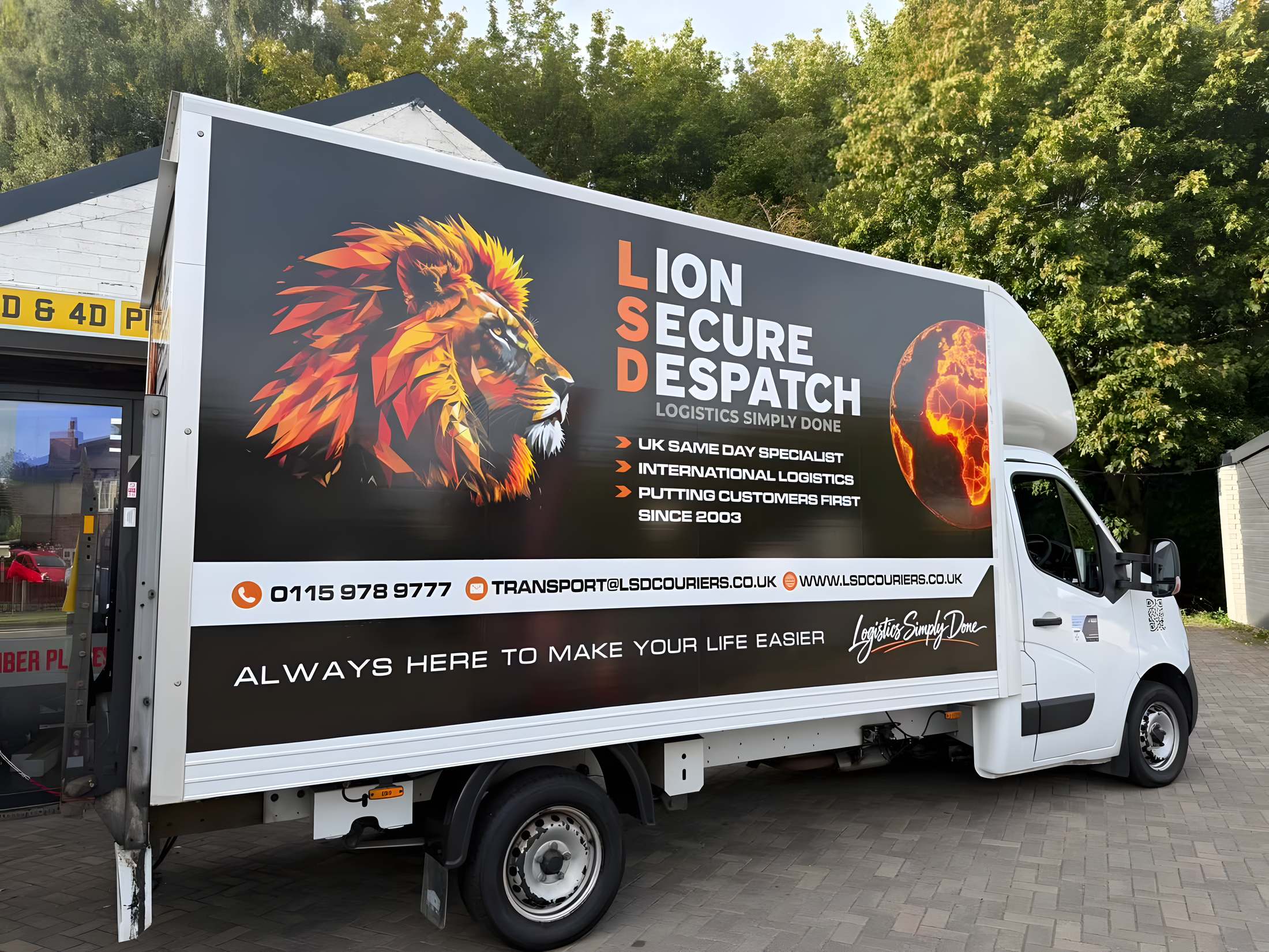 Side panel of the Lion Secure Despatch lorry with printed lion and Africa graphics