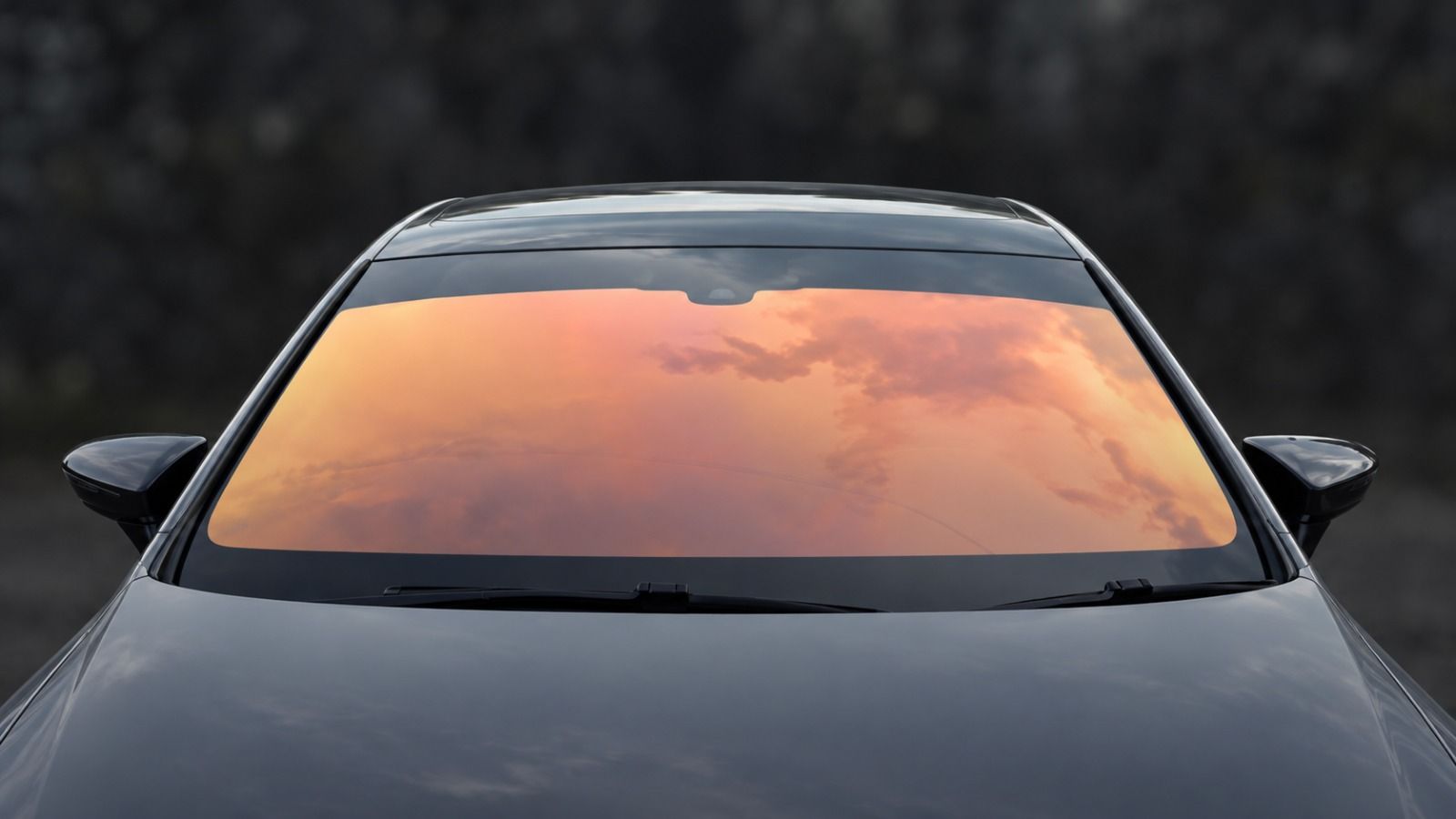 Chameleon tint on a car windscreen shifting from orange to pink
