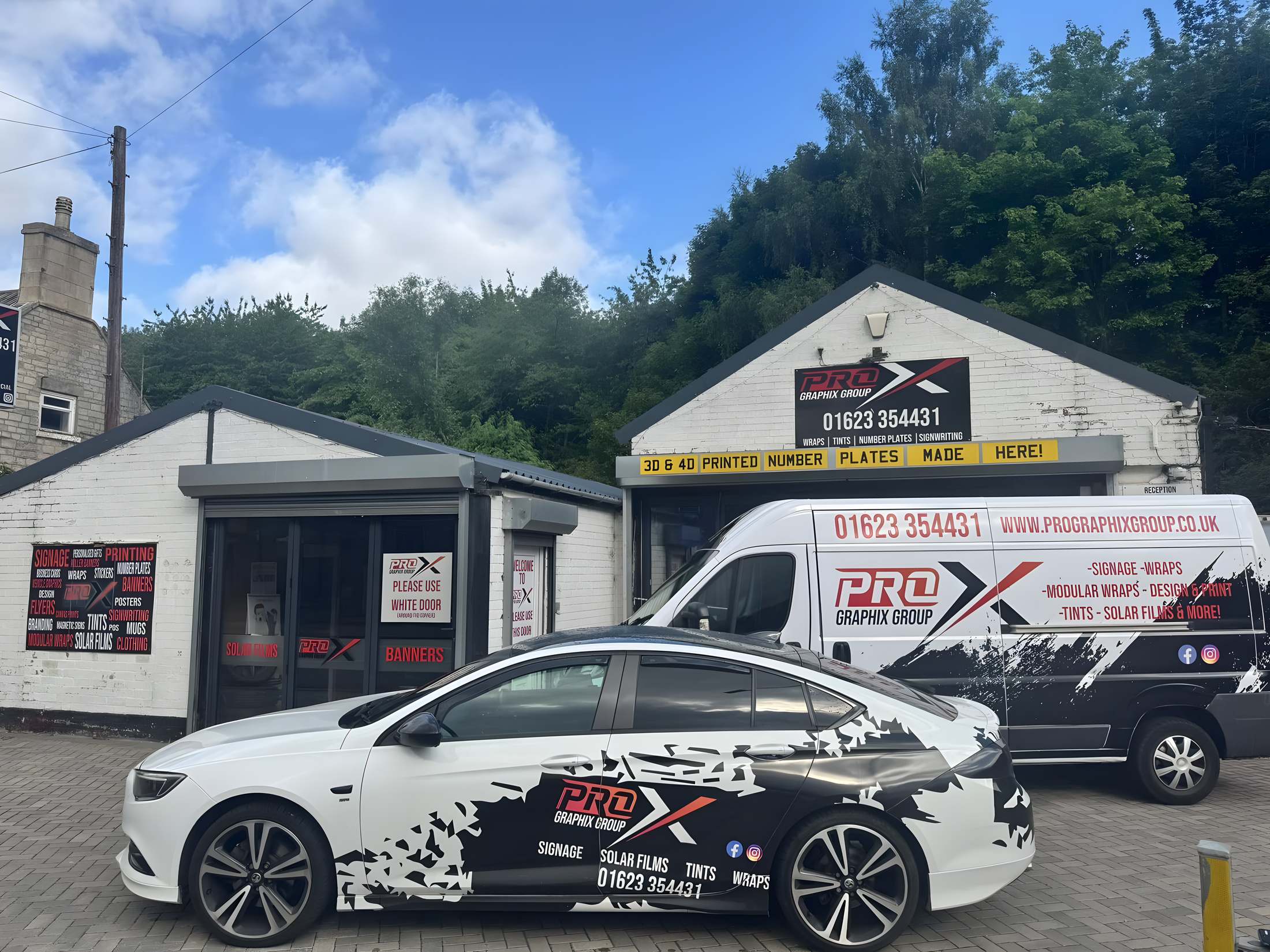 Pro Graphix Group unit on Main Road, Langwith, with a wrapped van and car outside