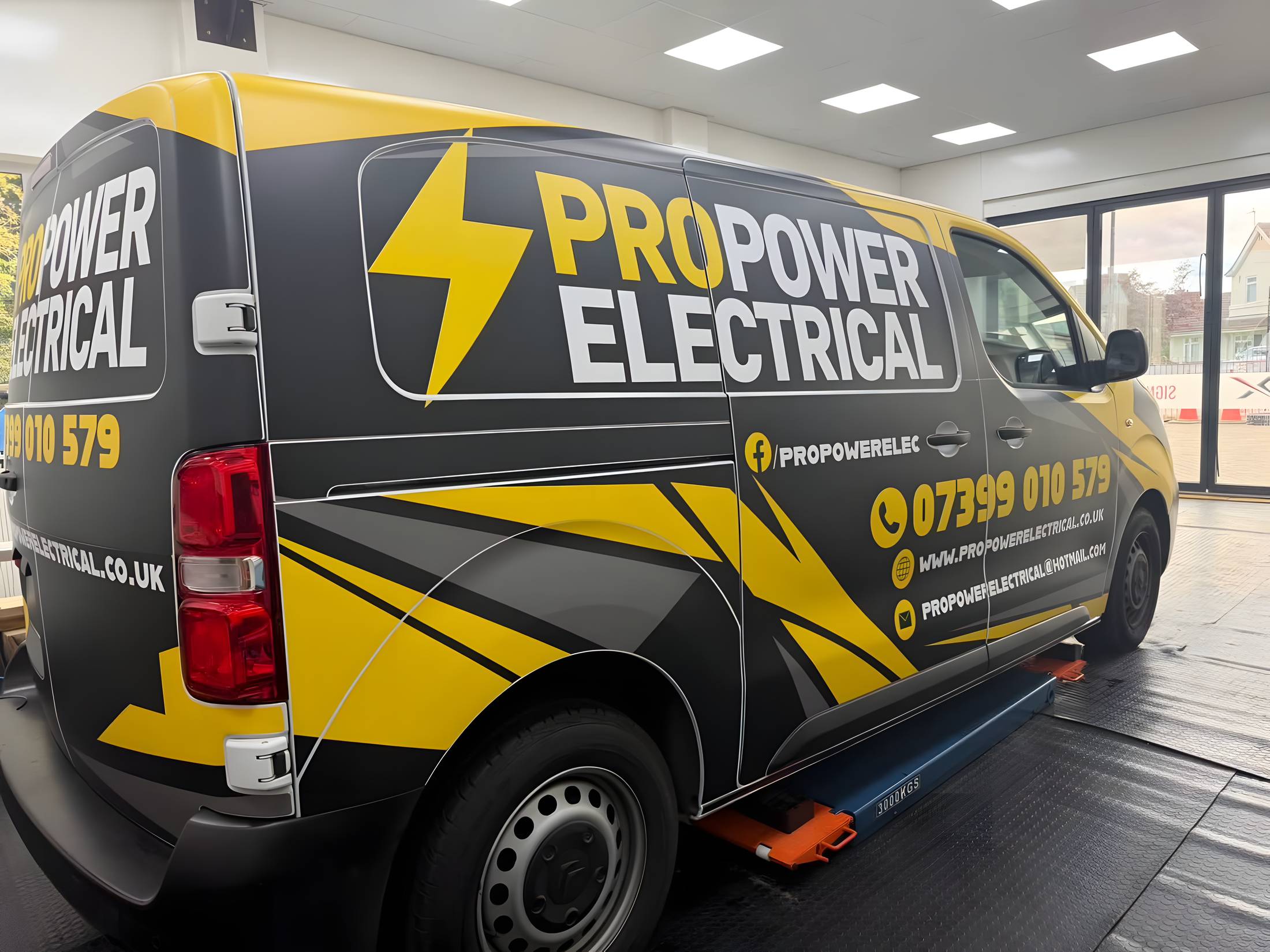 ProPower Electrical van wrapped in black and yellow graphics