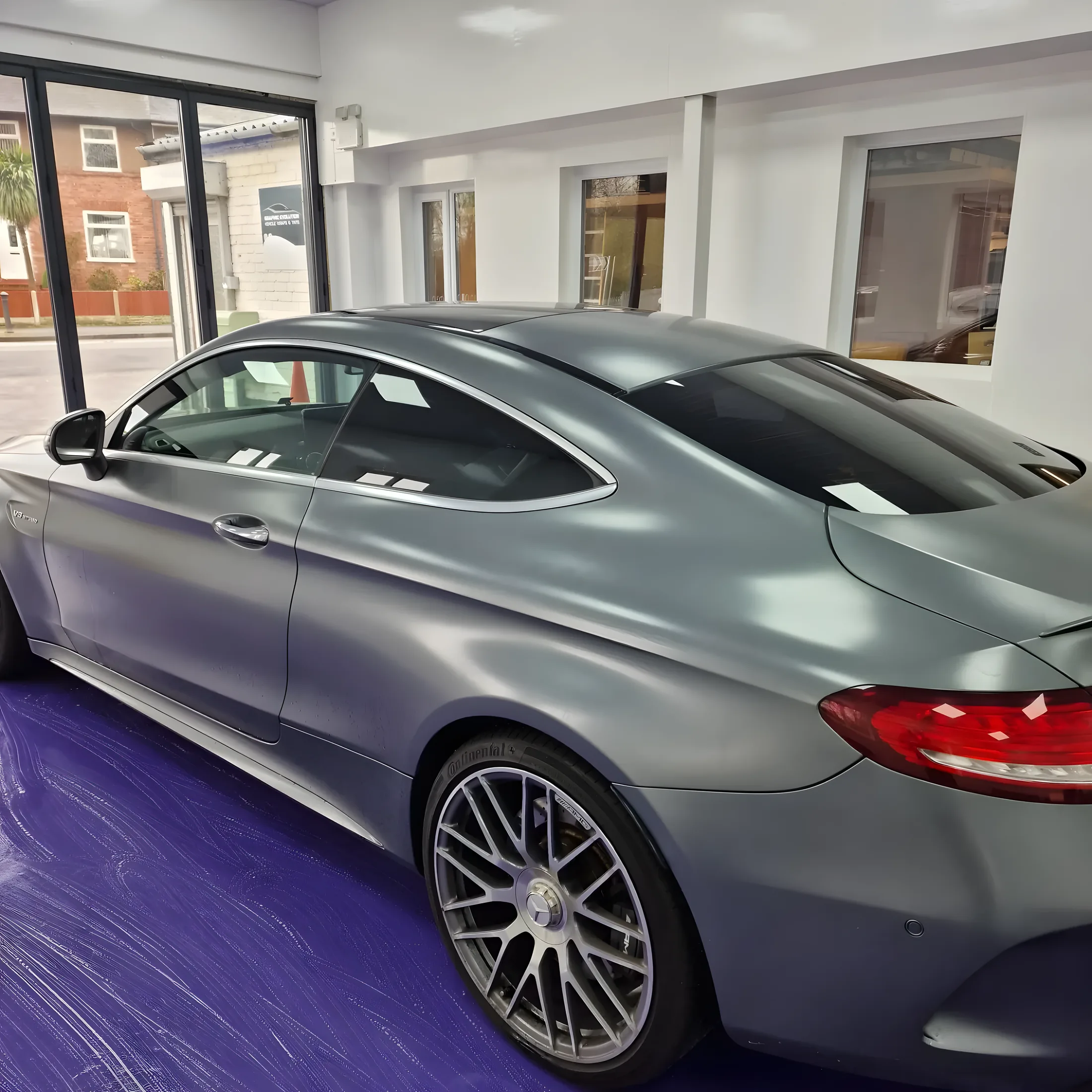 Mercedes coupe in satin grey wrap inside the Pro Graphix unit